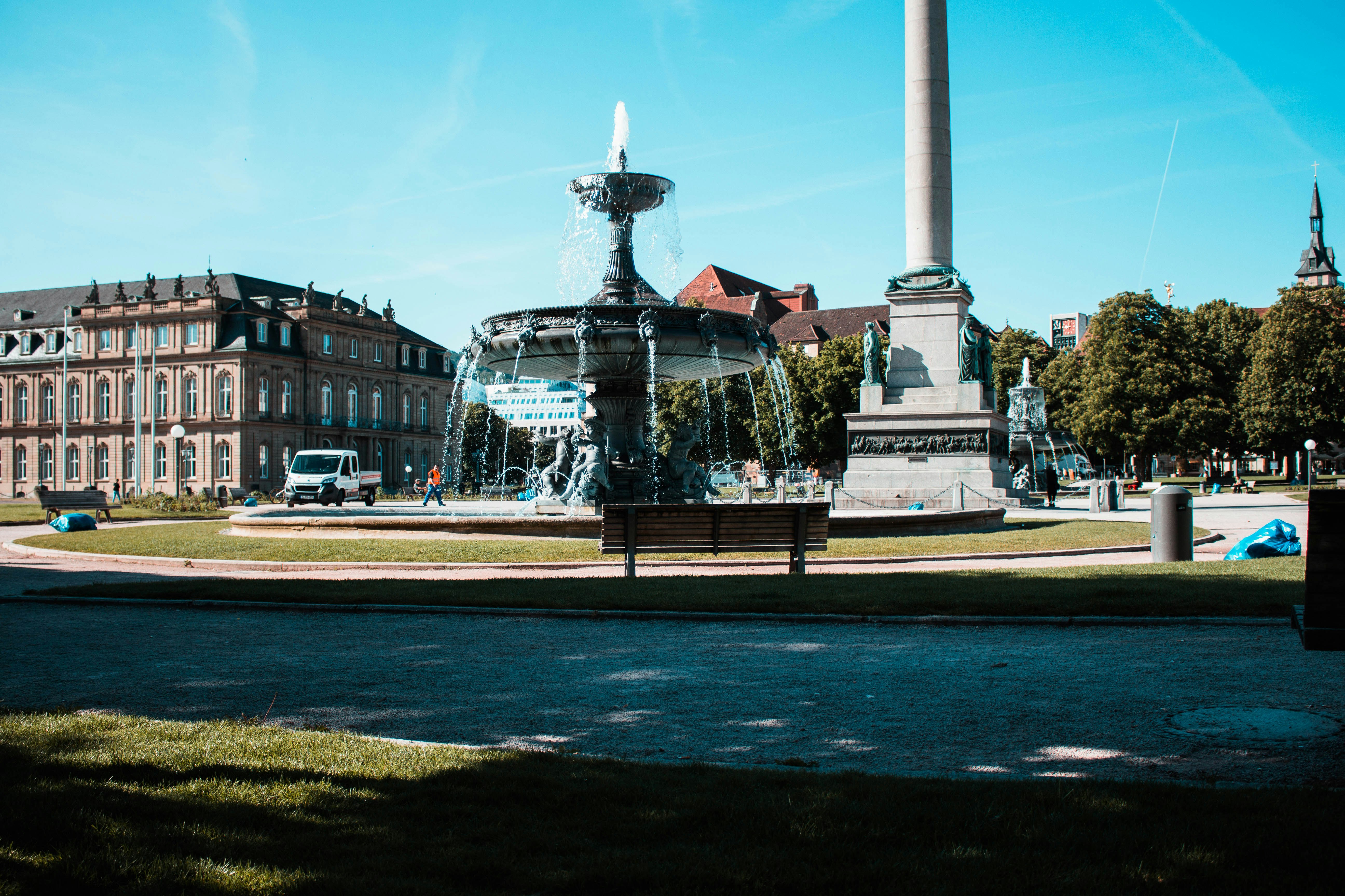 gray water fountain near brown structure